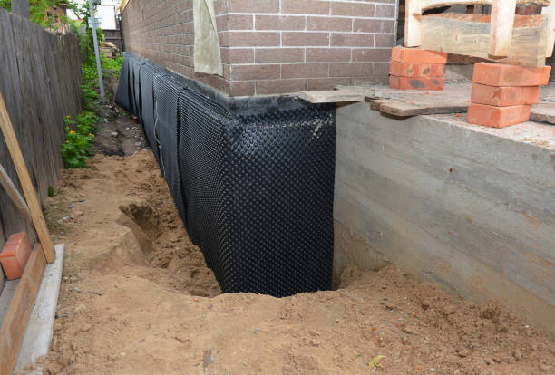 SJ Waterproofing Pros technician performing targeted Basement Waterproofing assessment in Cromwell, IN